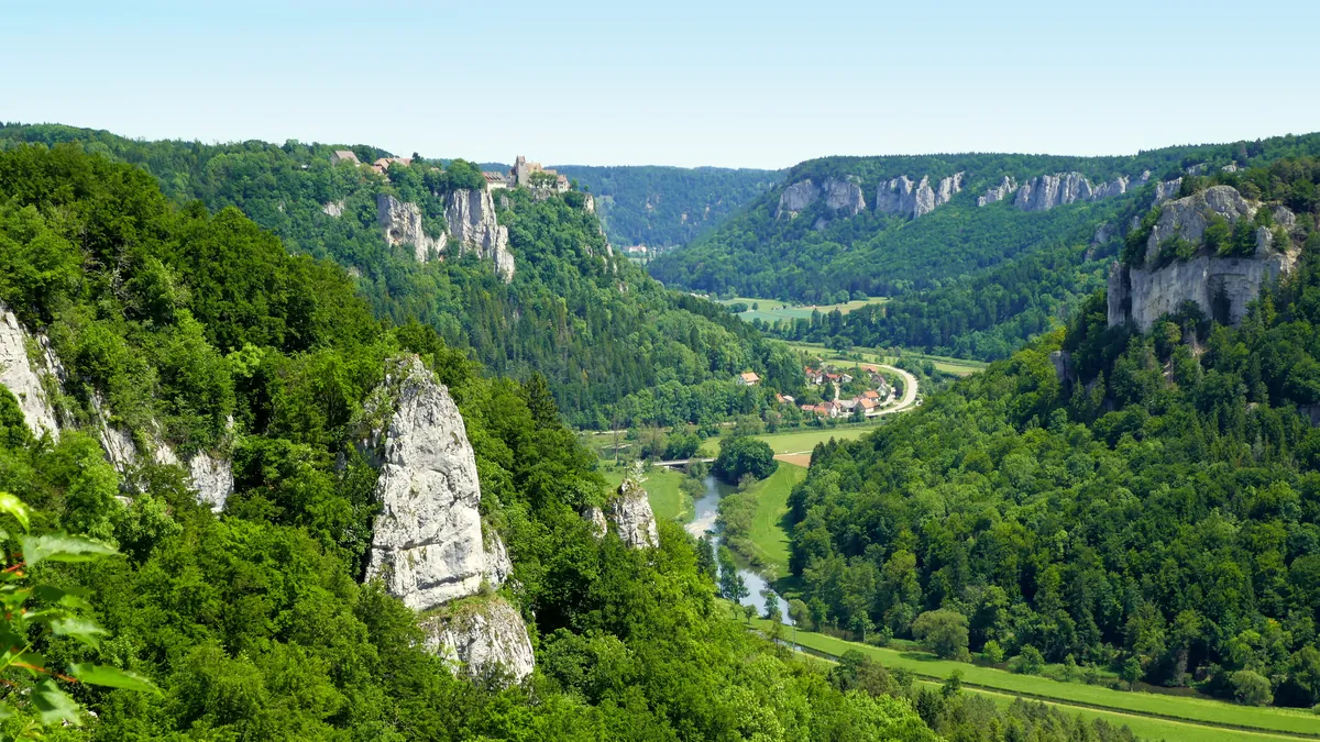 View across the Danube valley in the Upper Danube Nature Park with limestone cliffs, forest and river