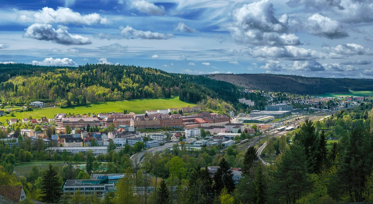 View across Tuttlingen with the town centre, station and the wooded hills around it